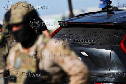 U.S. federal agents and immigration officers raid an agricultural facility in Camarillo
