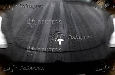 The logo of Tesla is seen on a Tesla car in Brussels