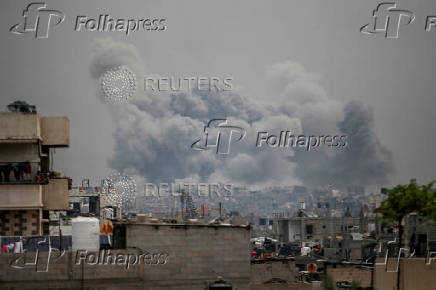 Smoke rises following Israeli strikes, in Jabalia