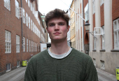 Harvard student Alfred Williamson, who comes from Wales, stands in a street in Copenhagen