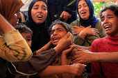 Funeral of a Palestinian killed, in what the Gaza health ministry says was Israeli fire near a distribution center in Rafah, at Nasser hospital in Khan Younis
