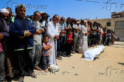 Mourners pray during the funeral of Palestinians killed in what the Gaza Health Ministry said were Israeli airstrikes, in Khan Younis
