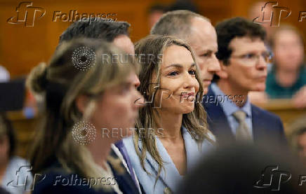 Karen Read smiles as the not guilty verdict is read during her trial at Norfolk Superior Court in Dedham