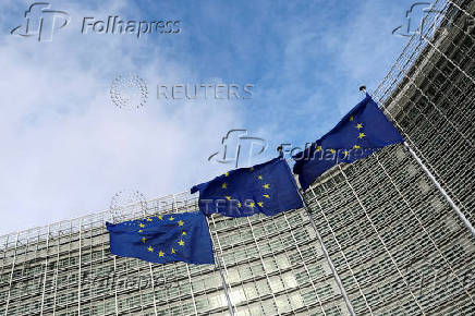 FILE PHOTO: EU flags fly outside the European Commission in Brussels