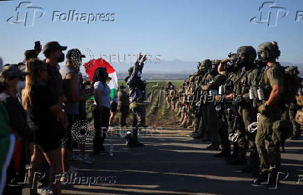 U.S. federal agents and immigration officers raid an agricultural facility in Camarillo