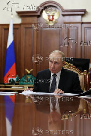 Russian President Vladimir Putin attends a meeting with Vladimir Saldo, Moscow-installed leader of the Russian-controlled parts of the Kherson region, in Moscow