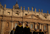 Nuns walk in front of St. Peter's Basilica in St. Peter's Square ahead of the conclave, which will be held on May 7, at the Vatican