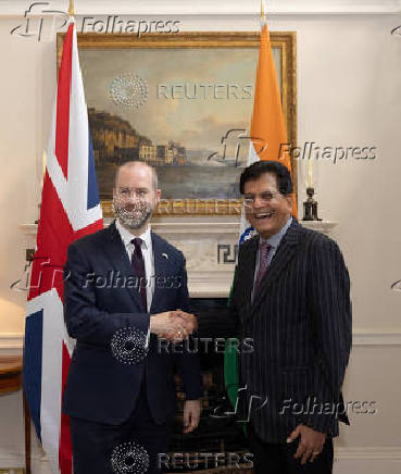 Britain's Secretary of State for Business and Trade Jonathan Reynolds welcomes Indian Minister of Commerce and Industry Piyush Goyal for trade talks, in London