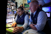 Traders work on the floor of the NYSE in New York