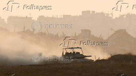 An Israeli tank manoeuvres in Gaza