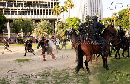 Protests against federal immigration sweeps continue in Los Angeles