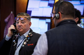 Traders work on the floor of the NYSE in New York