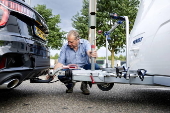 Vacationers have their vehicles checked at the border crossing with Belgium