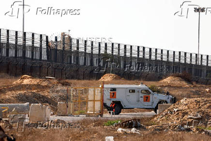 Humanitarian aid is waited to be transferred into Gaza from Israel, at the Gaza part of the Kerem Shalom crossing in the Gaza Strip