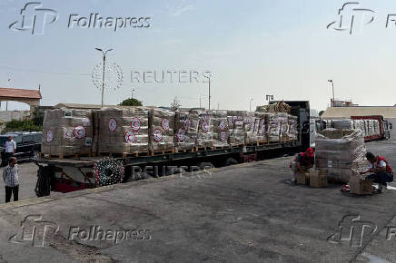 Humanitarian aid waits to be delivered to Gaza, outside Arish