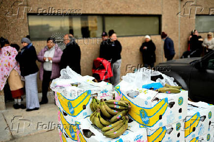 People wait in line outside Adams County Emergency Food Bank, weeks into the continuing U.S. government shutdown, in Commerce City