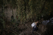 Chilean volunteers combat plastic waste in the Mapocho river, in Santiago