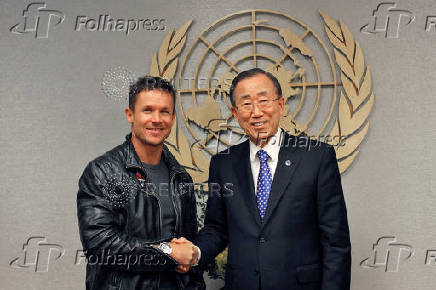 FILE PHOTO: Pilot Baumgartner of Austria shakes hands with U.N. Secretary-General Ban Ki-moon during a photo opportunity at UN headquarters in New York