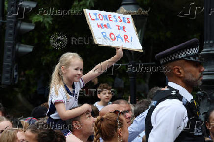 England fan celebrates during the Homecoming Victory Parade