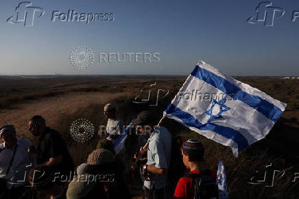Israeli right wing activists take part in a rally organized by settlers groups to promote Israel's resettling in Gaza