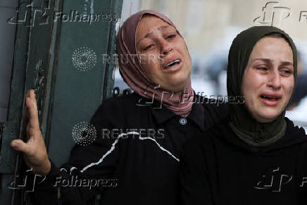 Funeral of Palestinians killed on Sunday by Israeli fire while seeking aid in northern Gaza, according to Gaza's health ministry, at Al-Shifa Hospital