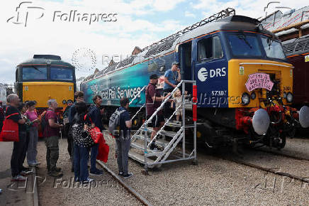 Visitors queue to view the interior of the British Rail Class 57 locomotive at The Greatest Gathering, a railway festival marking 200 years of rail history, at Alstom?s Litchurch Lane factory in Derby