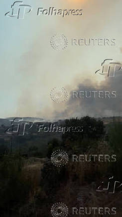 Thick smoke fills the air in northwest Spain as wildfire rages