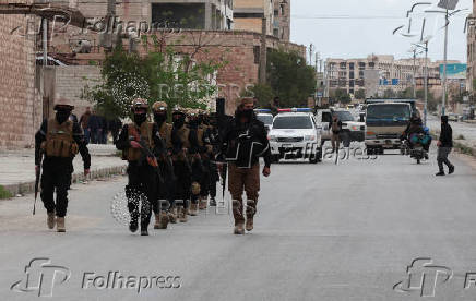 Soldiers from the Public Security march in formation in Aleppo