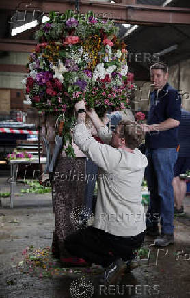 The Garland is created inside the Castleton garage ahead of the annual Garland Day parade in Castleton