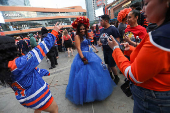 Edmonton Oilers fans react in a fan zone during the first game of the Stanley Cup Finals against the Florida Panthers, in Edmonton