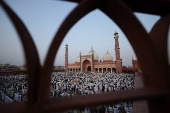 Muslims offer prayers at Jama Masjid on the occasion of Eid al-Adha, in the old quarters of Delhi