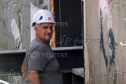 Beginning of the restoration process of Banksy's 'Migrant Child', in Venice