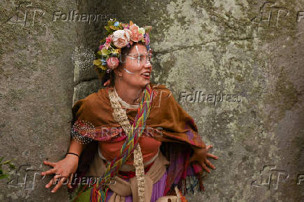 Revellers attend summer solstice celebrations during sunrise at Stonehenge near Amesbury