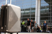 Israeli nationals arrive at Ben Gurion International airport from abroad, in Tel Aviv