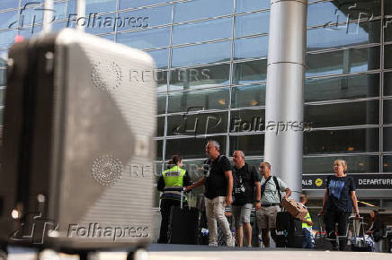 Israeli nationals arrive at Ben Gurion International airport from abroad, in Tel Aviv