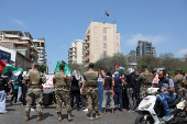 Lebanese army stands guard as demonstrators gather during a protest against hunger crisis in Gaza
