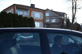 A man drives a car near a presidential election campaign poster of Slawomir Mentzen, candidate of far-right political alliance Confederation, in Punsk
