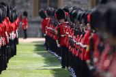 Members of The Coldstream Guards stand inside the Quadrangle ahead of a ceremony at Windsor Castle