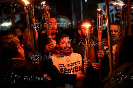 Argentine university teachers and students hold torches during a protest against Argentine President Javier Milei?s education budget, in Buenos Aires