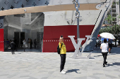 A man takes a selfie outside the new Louis Vuitton store in Shanghai