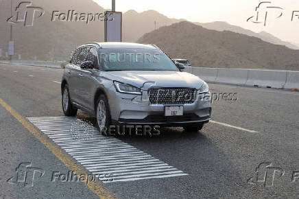 A vehicle drives over rumble strips that play Ludwig van Beethoven's Ninth Symphony on a highway dubbed 'Musical Road', in Fujairah