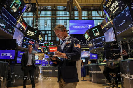 A trader works on the floor at the New York Stock Exchange (NYSE) in New York City