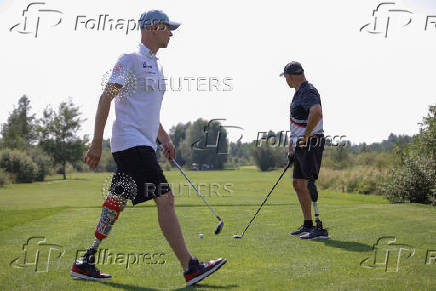Ukrainian war veterans take part in a golf tournament outside of Kyiv