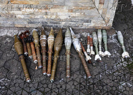 FILE PHOTO: Abandoned rocket-propelled grenades (RPG) that belonged to the Armed Forces of the Democratic Republic of Congo (FARDC) lie at Goma airport