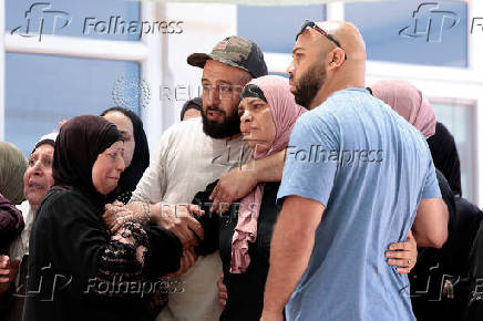Mourners take part in the funeral of Mohammad Al-Shalabi, near Ramallah