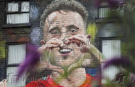 A mural honouring Diogo Jota appears in Liverpool