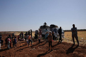 People gather on land between Deraa and Sweida after Druze unrest