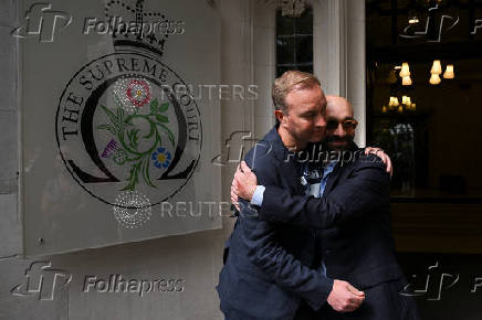 Former UBS and Citigroup trader Tom Hayes and former Barclays trader Carlo Palombo celebrate after their conviction for manipulating the LIBOR benchmark was overturned