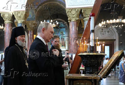 Russian President Putin visits a cathedral in Kronstadt