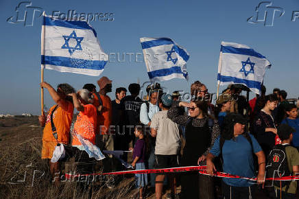 Israeli right wing activists take part in a rally organized by settlers groups to promote Israel's resettling in Gaza
